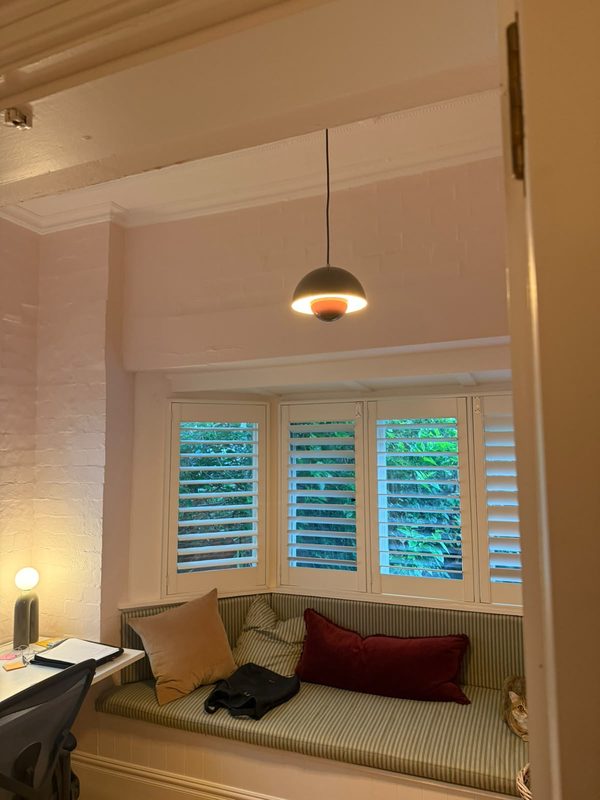 A small pendant light above a window seat